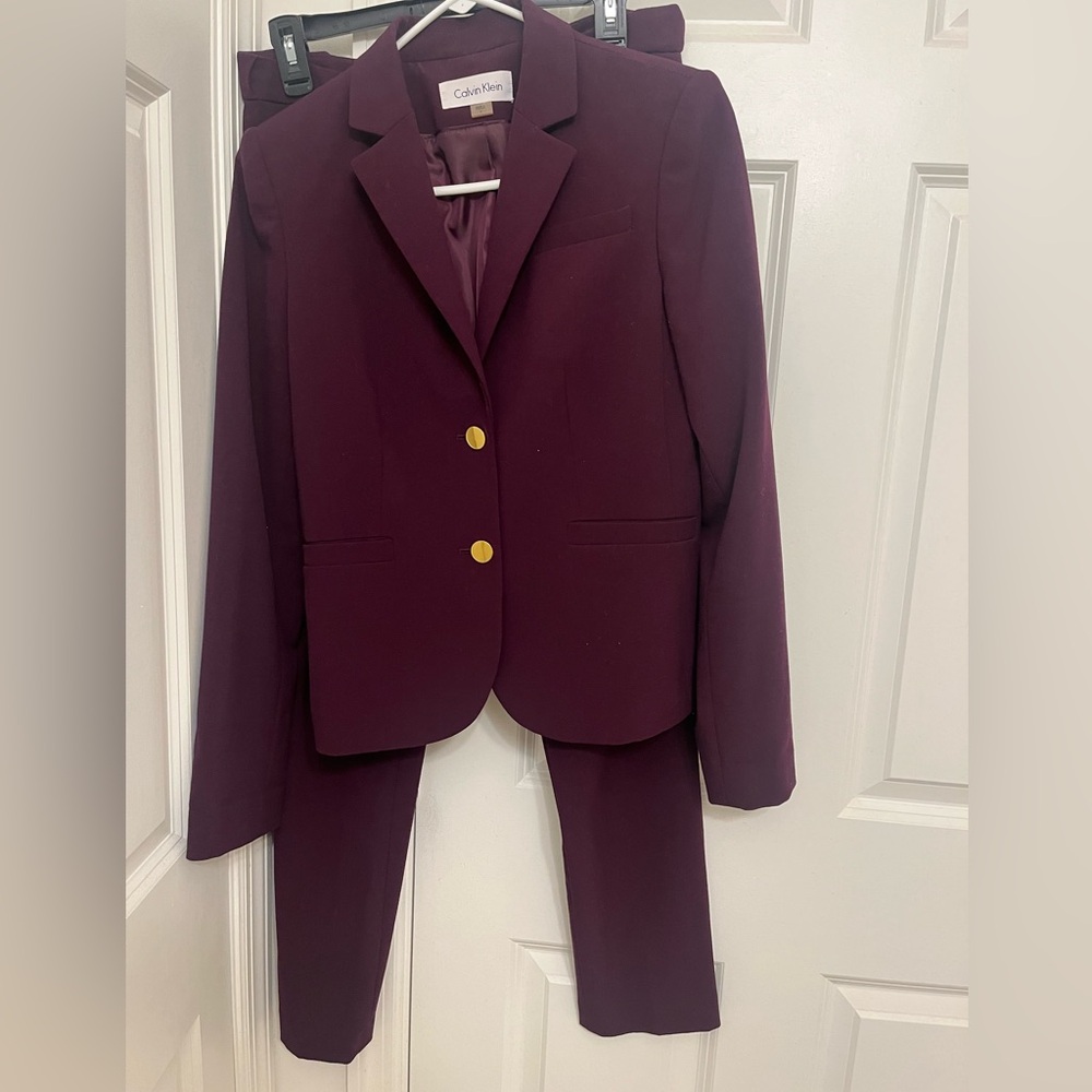 Calvin Klein plum suit.